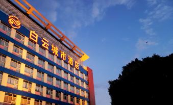 The hotel in an urban setting features a front view with large windows and a prominent sign at Baiyun City Hotel (Guangzhou Railway Station Subway Branch)