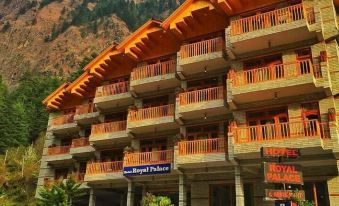 "a large wooden building with a sign that reads "" himachal pradesh "" in front of it" at Hotel Royal Palace