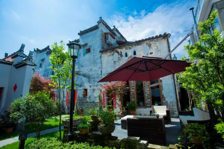 Zhicheng Hall Huizhou Home Stay Отели рядом с достопримечательностью «Guzhang Folklore Garden»