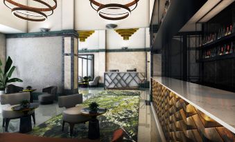 a modern hotel lobby with a marble reception desk , seating area , and a large painting at DoubleTree by Hilton Wellington