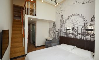 This bedroom features a double bed and a view on the opposite side at Meego Qingwen Hotel