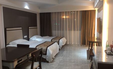 Huayi Business Hotel - Housity