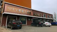Kezuo Zhongqi New Land Hotel