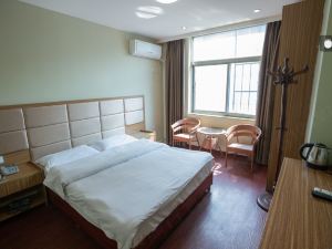 Jiujiang Shenlong Apartment Hotel