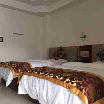 Santai Jinbo Business Hotel Rooms