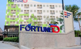 "a large sign with the word "" fortunided "" prominently displayed on it , situated in front of a hotel" at Fortune D Hotel Loei