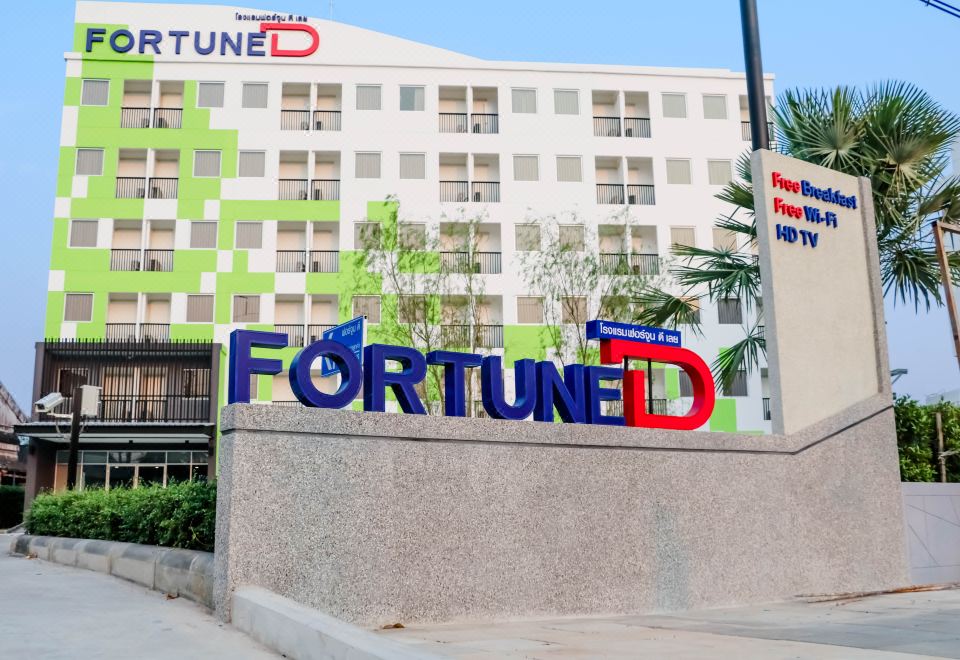 "a large building with a sign that reads "" fortune "" prominently displayed on the side of the building" at Fortune D Hotel Loei