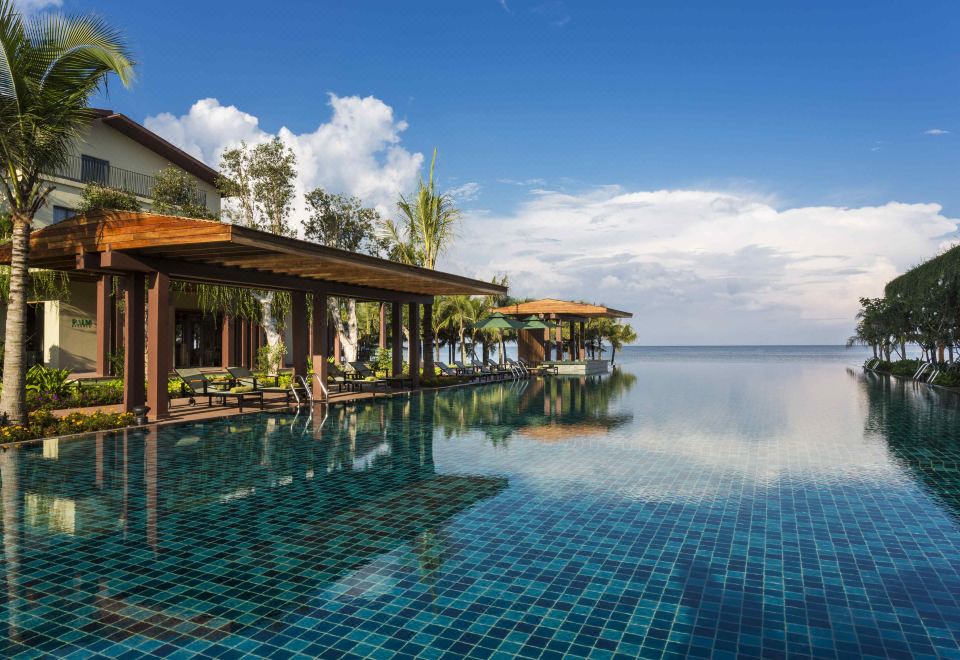 Dusit Princess Moonrise Beach Resort oceanfront infinity pool and tropical gardens