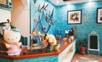 Luoping Huaying Image Theme Inn