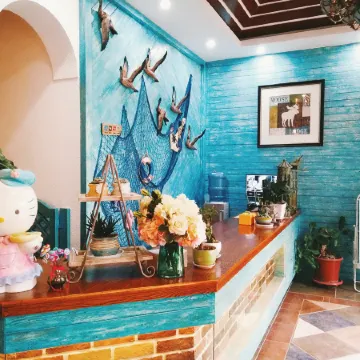 Luoping Huaying Image Theme Inn