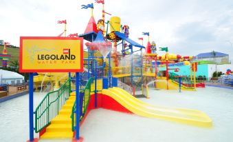 a colorful playground with a slide and other play structures for children to enjoy at Hallmark Regency Hotel - Johor Bahru