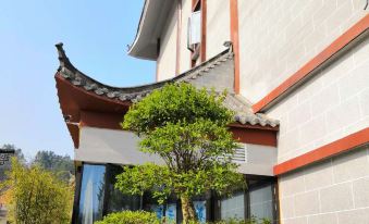 New Beacon Shangju Hotel (Yingshan Tourist Center Chaxiang Small Town)