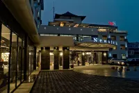 張家港新世滙飯店（沙洲路步行街曼巴特廣場店） 沙洲公園附近的飯店