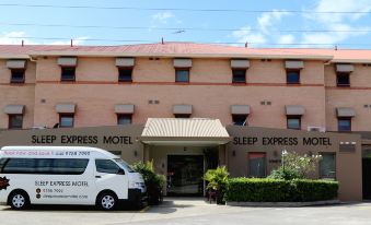 "a hotel with a sign that reads "" sleep express motel "" on the front of the building" at Arena Hotel (Formerly Sleep Express Motel)