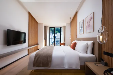 Three Flower Hotel Отели рядом с достопримечательностью «Pingqiao Stone Dam»