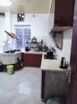 Xinchang Fangya Homestay - مطابخ