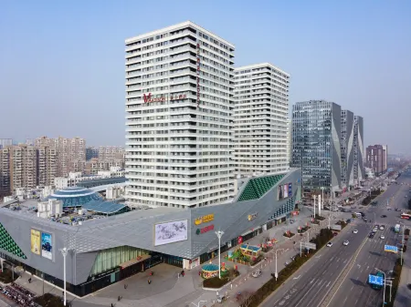 Madison Hotel (Jinan Wanda Plaza Exhibition Center) Отели рядом с достопримечательностью «Shandong Polytechnic West Campus»