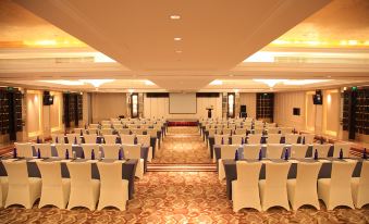 There is a large ballroom arranged with tables and chairs for an event at Boyue Hotel Shanghai Air China Hongqiao Airport