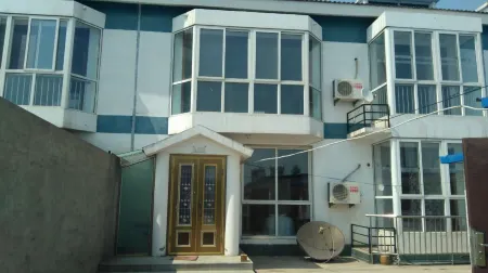 Laoting Aijia Farm House Отели в г. Лэтин