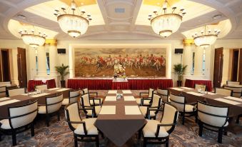 a dining room with tables and chairs set up for a formal event , possibly a wedding reception at Wellington Hotel