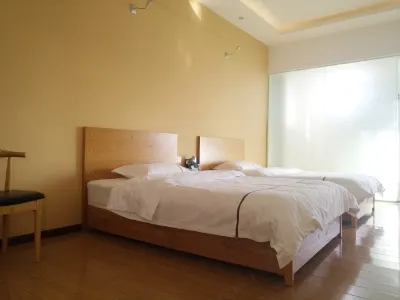 Mangshi Xinyi Hotel Hotels near Dehong Vocational College