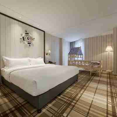 信陽橙子精品酒店（和美廣場店） Rooms