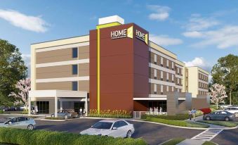 "a car is parked in front of a modern building with the sign "" home 2 "" on it" at Home2 Suites by Hilton Hagerstown