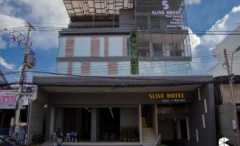 "a modern building with a sign that reads "" silverwater hotel "" prominently displayed on the front" at Slive Hotel