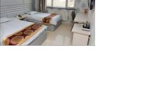 爱琴海假日主题连锁酒店(庄河客运站店) - 标准双床房