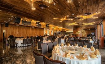 The restaurant in the center is decorated like a venue for an event, with tables and chairs set up at The Macau Roosevelt