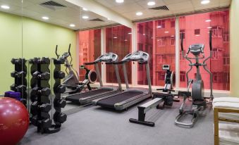 A well-equipped gym with treadmills and large windows is available for exercise at ibis Hong Kong Central and Sheung Wan Hotel