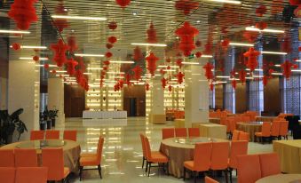 a large dining room with tables and chairs set up for a formal event , possibly a wedding reception at Spring Hotel