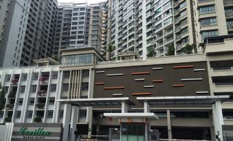 There is a large building with an apartment complex in the background and another one on the top floor at Covillea Bukit Jalil Room