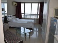 青岛海边人旅游公寓 - 温馨大床房