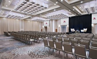 a large conference room with rows of chairs arranged in a semicircle , ready for an event at Guyana Marriott Hotel Georgetown