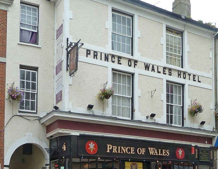 "a brick building with a sign that reads "" prince of wales hotel "" prominently displayed on the front of the building" at The Prince of Wales Pub