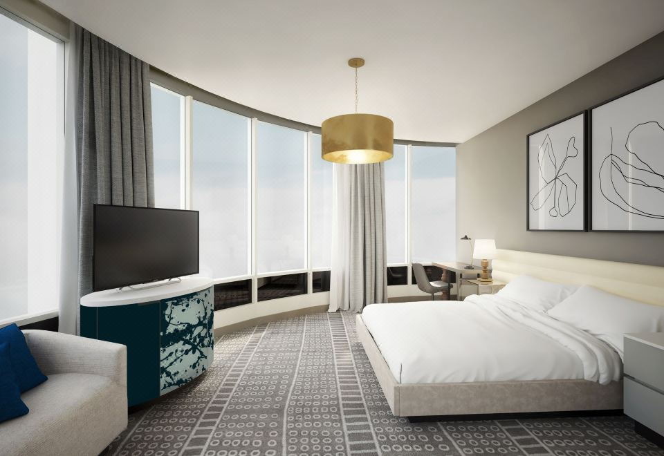 a modern hotel room with a large window , a bed , a couch , and a tv at The MC Hotel, Autograph Collection