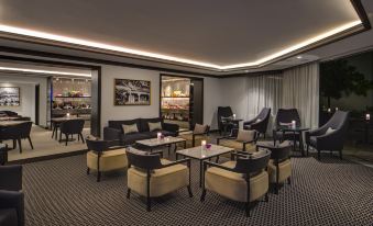 a spacious room with multiple chairs and couches arranged in a sitting area , creating a comfortable and inviting atmosphere at InterContinental Sydney Double Bay
