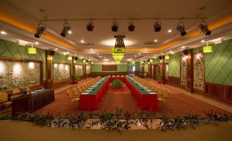 a large conference room with multiple rows of tables and chairs arranged for a meeting or event at Hotel Somadevi Angkor Resort & Spa