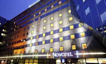 "a building with a large sign that reads "" novotel "" prominently displayed on the side of the building" at Novotel Marne-la-Vallée Noisy-Le-Grand