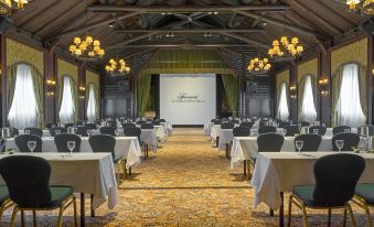 a large conference room with rows of tables and chairs arranged for a meeting or event at Fairmont le Château Montebello