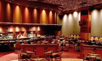 a large , empty restaurant with multiple dining tables and chairs arranged in an orderly fashion at Gold Country Casino Resort