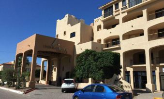 "a blue car is parked in front of a beige building with the sign "" markenhof "" on it" at Marinaterra Hotel & Spa