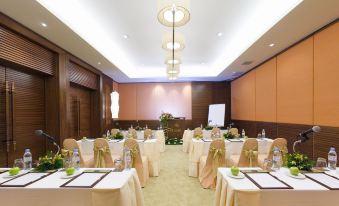 a conference room set up for a meeting , with chairs arranged in rows and a whiteboard on the wall at Pimalai Resort & Spa