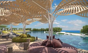 a poolside area with a large wooden canopy and various couches , chairs , and umbrellas , providing a relaxing atmosphere at Ivi Mare - Designed for Adults by Louis Hotels
