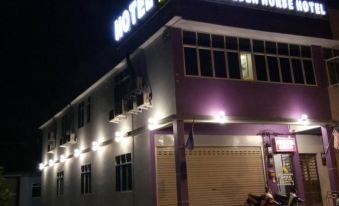 "a nighttime view of a building with the name "" golden house hotel "" written on it" at Muar Golden Horse Hotel