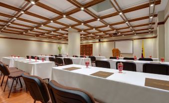 a large conference room with rows of chairs and tables set up for a meeting at Lancaster House