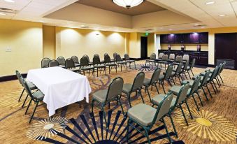 a large conference room with multiple tables and chairs arranged for a meeting or event at Grayson Manor