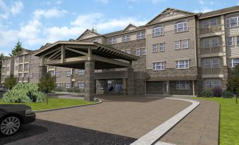 an architectural rendering of a modern building with stone walls , large windows , and a covered entrance at Hyatt House Minot