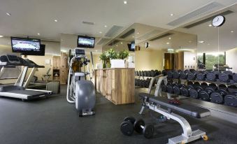 There is a spacious room in the center of the hotel with multiple exercise equipment and an indoor fitness center at The Harbourview-Chinese YMCA of Hong Kong